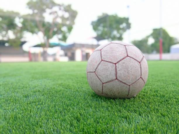 istock Football on grass 1389470434