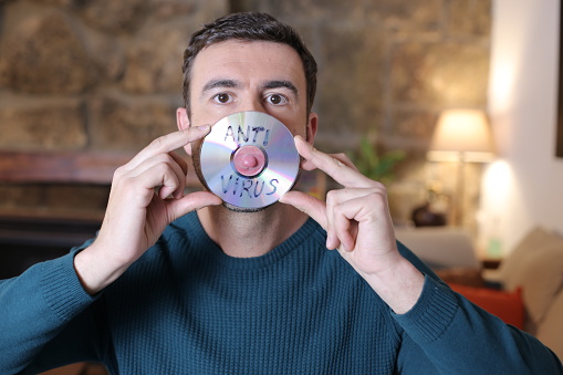 Comedian wearing antivirus cd protective mask.