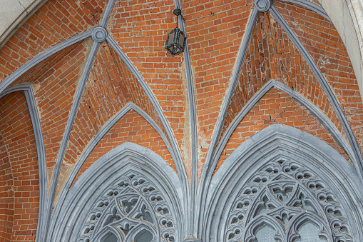 a fragment of the facade of a historic neo-Gothic church.