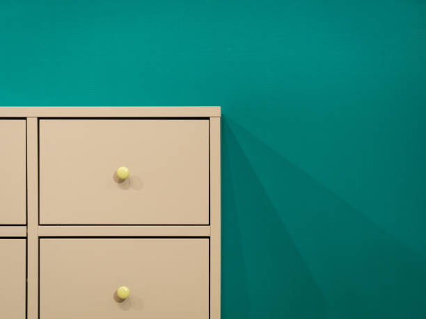 White cabinet on green background