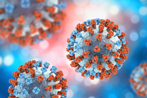 Influenza virus, 3D illustration showing surface glycoprotein spikes hemagglutinin (blue) and neuraminidase (orange). The hemagglutinins have glycans (green) that modulate immune response to the flu