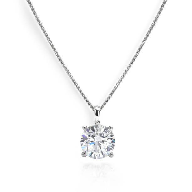 Solitaire Diamond Necklace Solitaire diamond necklace on chain, isolated on white background pendant stock pictures, royalty-free photos & images