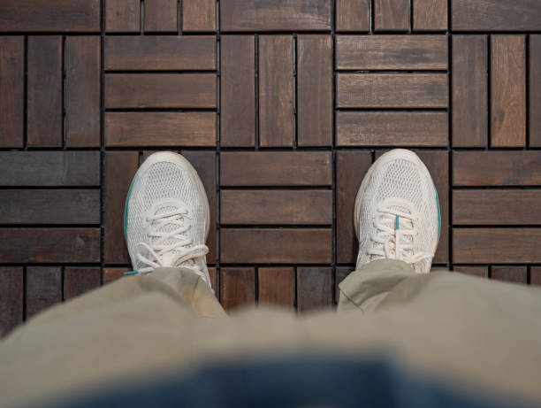 Men Standing on the Wood Floor