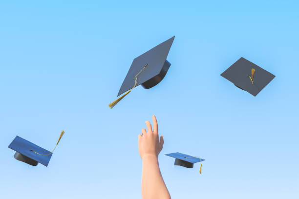 istock Academic hats and arm of student against blue backdrop 1389476667