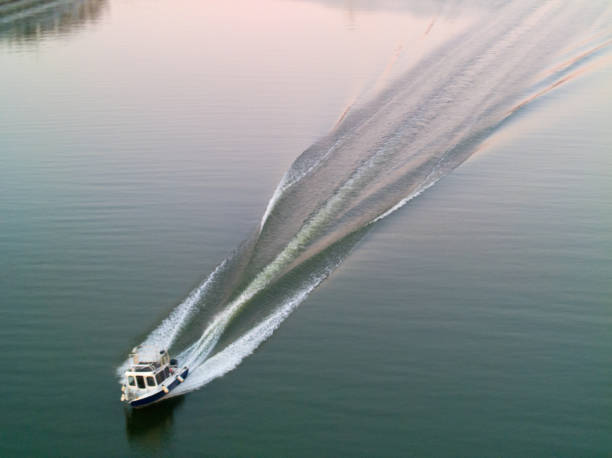 istock The small light boat sails very fast in the water 1389478542