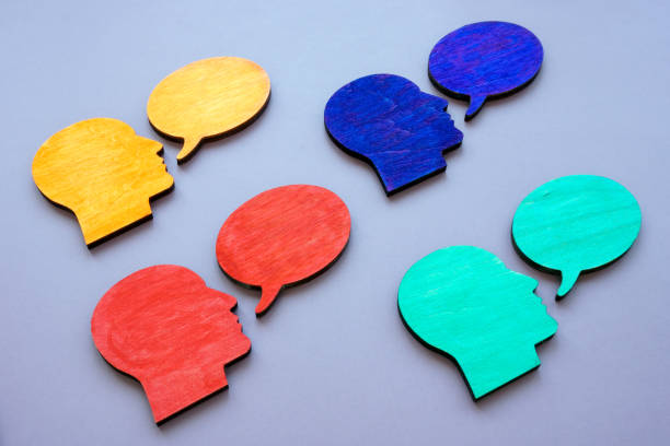 istock Cultural diversity concept. Head figurines and Speech balloon. 1389478731