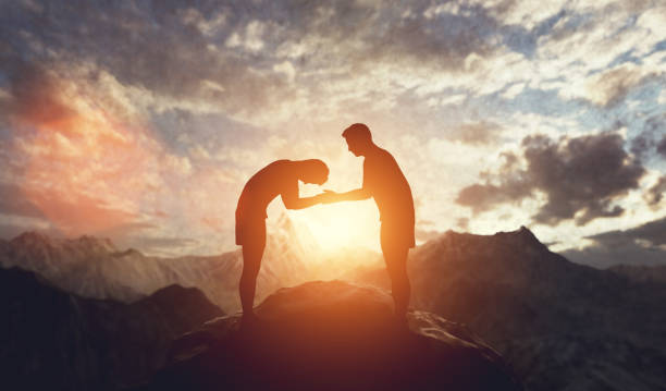 istock Men handshake and bowing. Respect and compromise 1389479441