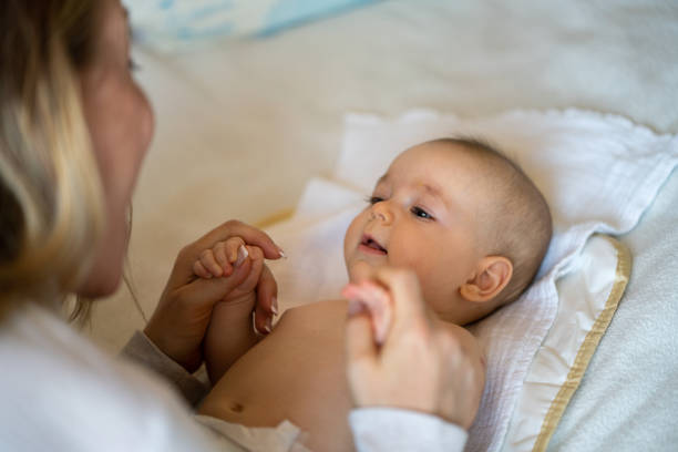 istock Baby and mother at home 1389479838