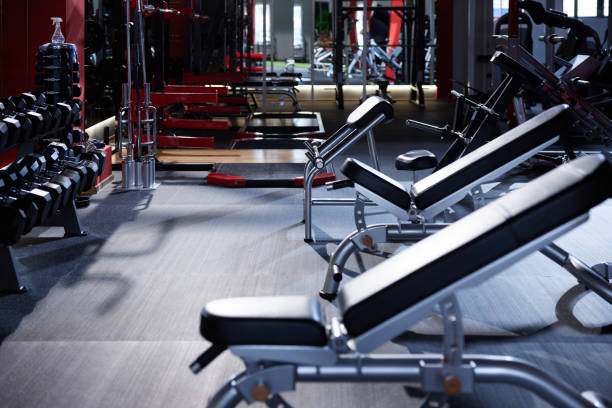 istock Large group of exercise machines and equipment in a gym. 1389480748