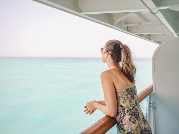 Beautiful woman standing on the empty deck