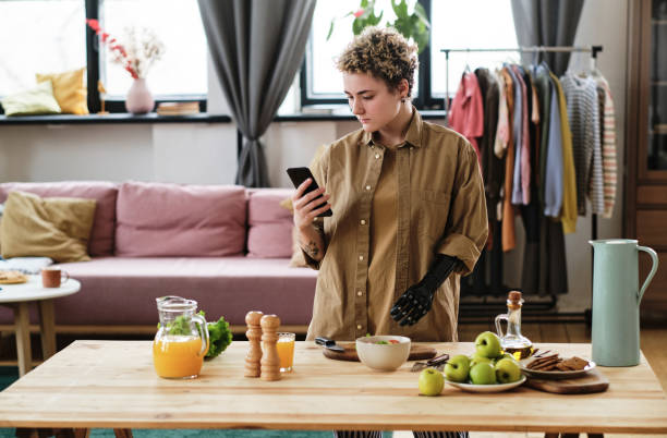 istock Woman using phone to prepare food 1389482420