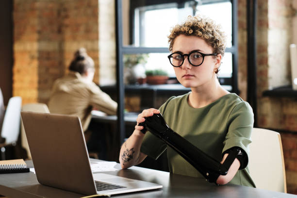 istock Woman sitting at her workplace with laptop 1389483640