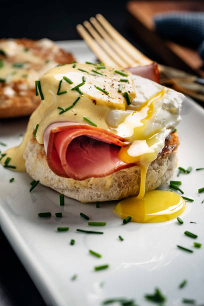 istock Eggs Benedict with Ham and Hollandaise Sauce 1389483747