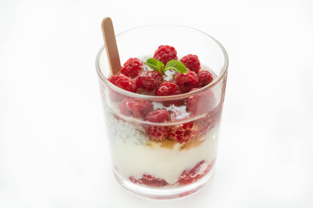 Breakfast parfait made from Greek yogurt with Mixed Berries on a white backgrounds. Healthy desserts concept