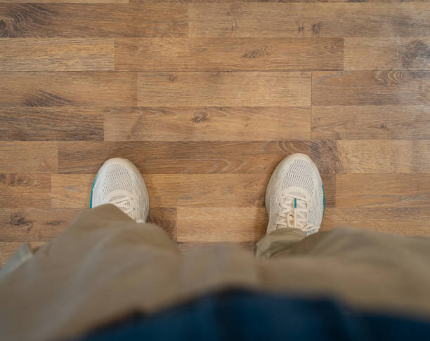 istock Men Standing on the Wood Floor 1389484067