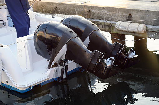 Two outboard boat motor. Selective focus.