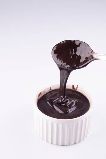 istock pouring dark chocolate cream with spoon isolated on white background 1389485171