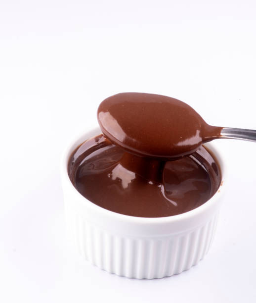 istock tasting chocolate hazelnut cream with spoon isolated on white background 1389485200
