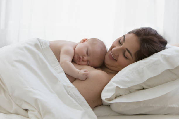 istock Mother sharing moment with her new born baby 1389486056