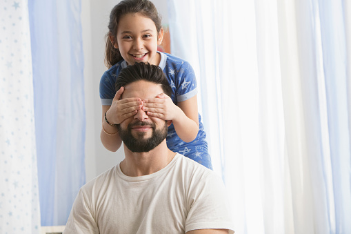 Father and daughter playing together