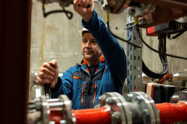 istock Stationary Engineer At Inspection In Boiler Room 1389494808