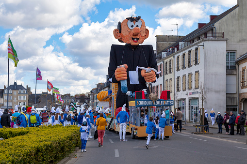 Landerneau, France - April 03 2022: Smurfs themed float of the Carnaval de la Lune Etoilée.
