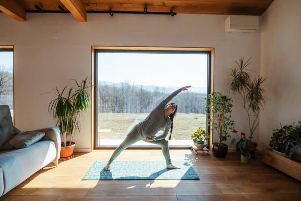 istock Future mother practicing yoga at home. 1389497516