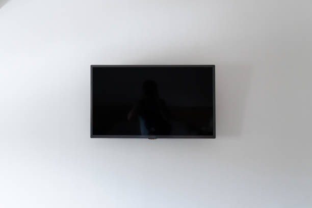 Tv on white clean wall stock photo