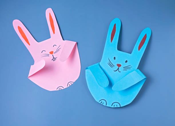 istock EASTER bunnies, paper craft with a child 1389497737