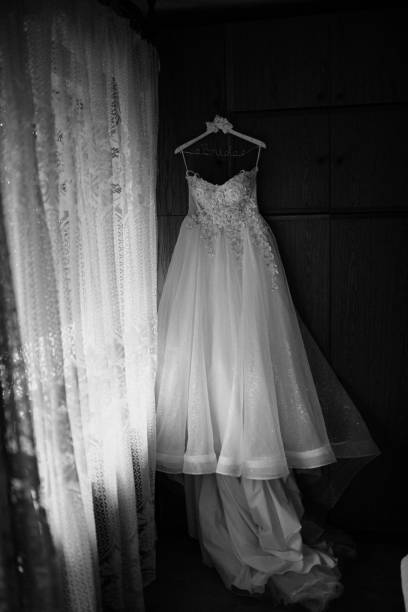 istock Beautiful wedding dresses on a hanger. 1389498898