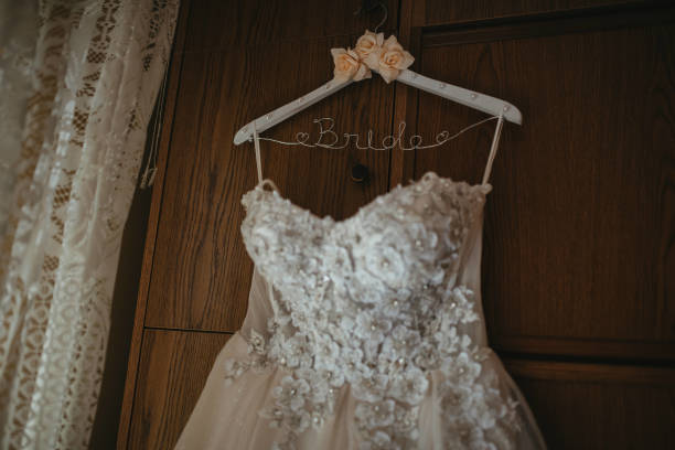 istock Beautiful wedding dresses on a hanger. 1389498912