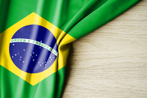 istock Brazil flag. Fabric pattern flag of Brazil. 3d illustration. with back space for text. 1389498934