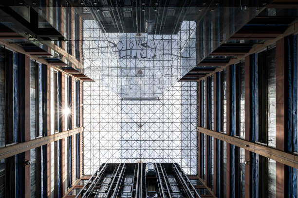 istock Low-angle view of the interior of a modern building. Elevator Interior. 1389499094