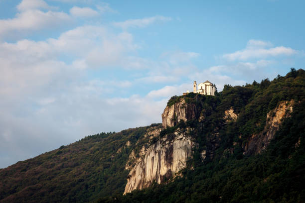 Low angle view of Madonna del Sasso sanctuary on mountain stock photo