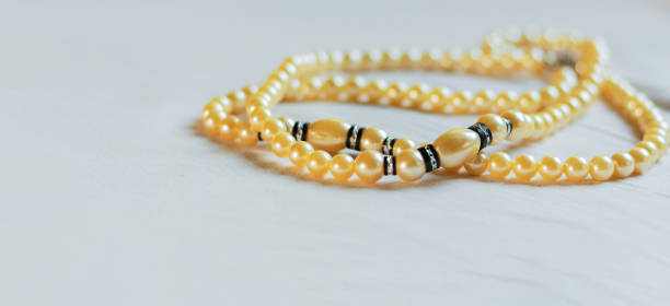 istock pearl necklace on gray background 1389503892