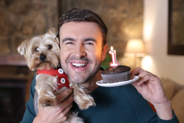 istock Man celebrating his dog´s birthday 1389505651