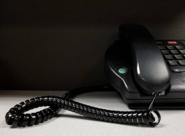 istock Multi Line Office Telephone Corded Landline on Desk. 1389505895