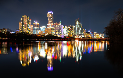 Night time Long exposure of Modern Capital Cities Skyline Cityscape Lady Bird Lake Reflections Austin Texas