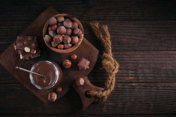 istock Homemade Chocolate Hazelnut Milk Spread on a dark Background 1389507294