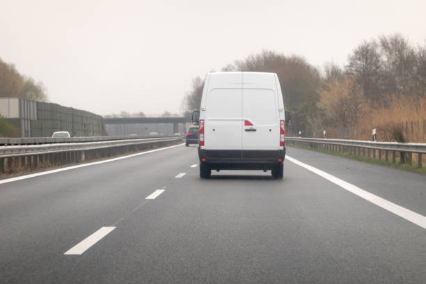 istock Rear view of white van - traveling on the freeway 1389509668
