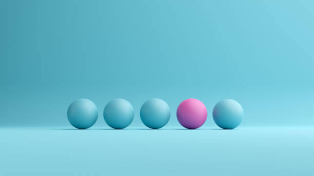 istock Pink ball stands out from the blue spheres 1389512422