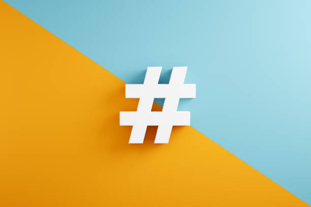 istock White hashtag symbol on blue and yellow background. 1389512490