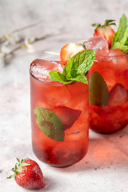 istock Refreshing strawberry summer drink glasses with ice cubes and mint leaves. 1389514622