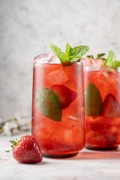 istock Refreshing strawberry summer drink glasses with ice cubes and mint leaves. 1389514695