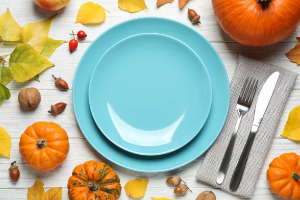 istock Flat lay composition with tableware, pumpkins and autumn leaves on white wooden background. Thanksgiving Day 1389514789