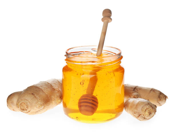 istock Ginger and honey on white background. Natural cold remedies 1389515126