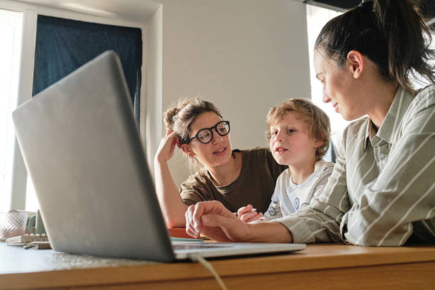 istock Family using laptop for online lesson 1389516400