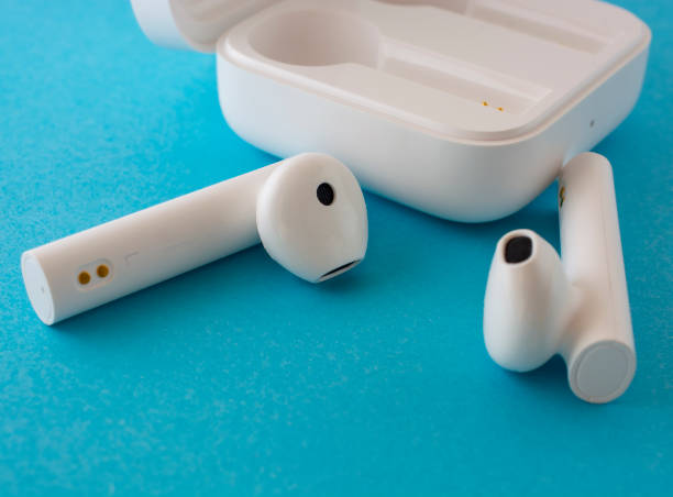 istock wireless white headphones with case that is and charging them. 1389516732