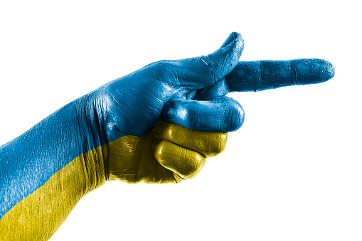 Hand showing direction in blue and yellow on white background.