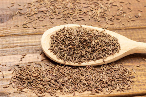 istock Cumin seeds in wooden spoon. Close up 1389518483